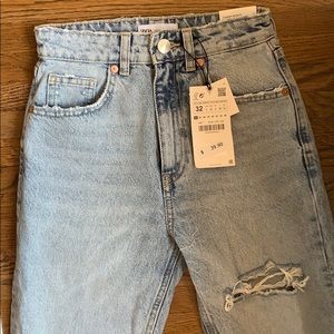 High waisted light blue ripped jeans